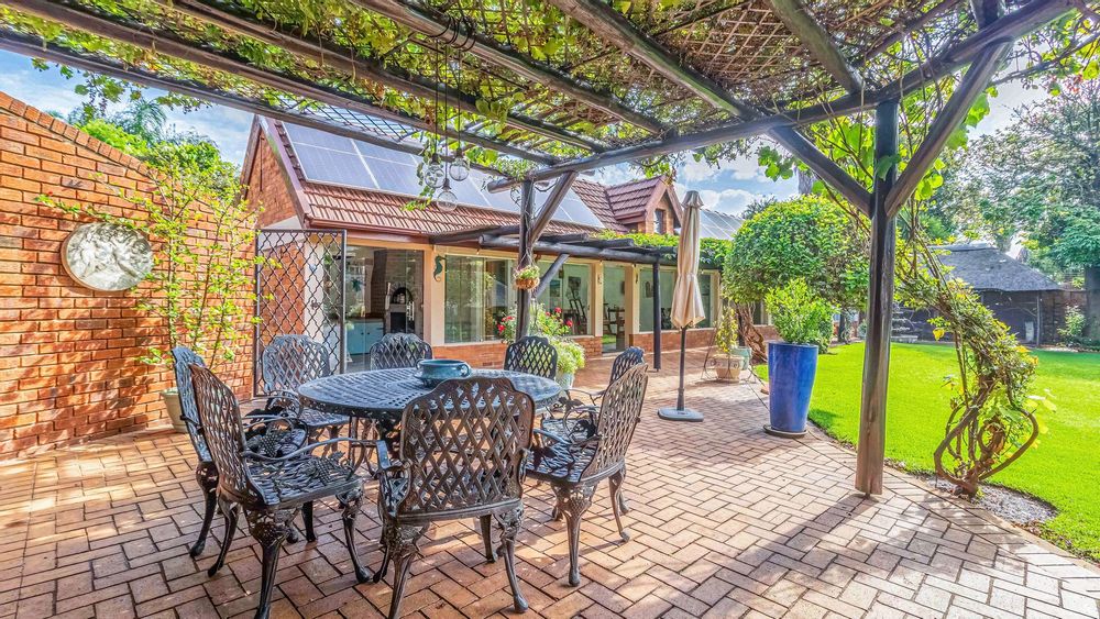 The grapevine over the patio provides shade to enjoy a meal outside