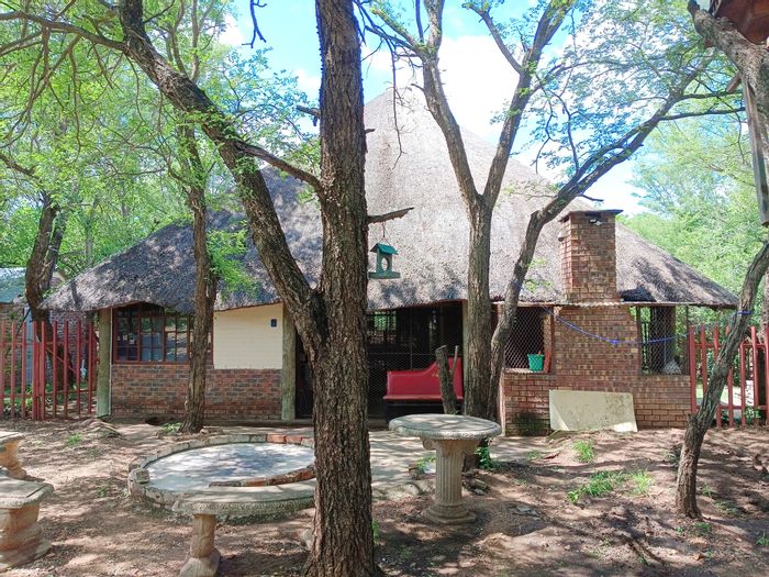 For Sale: House in Marloth Park Central with pool, borehole, and ample parking.