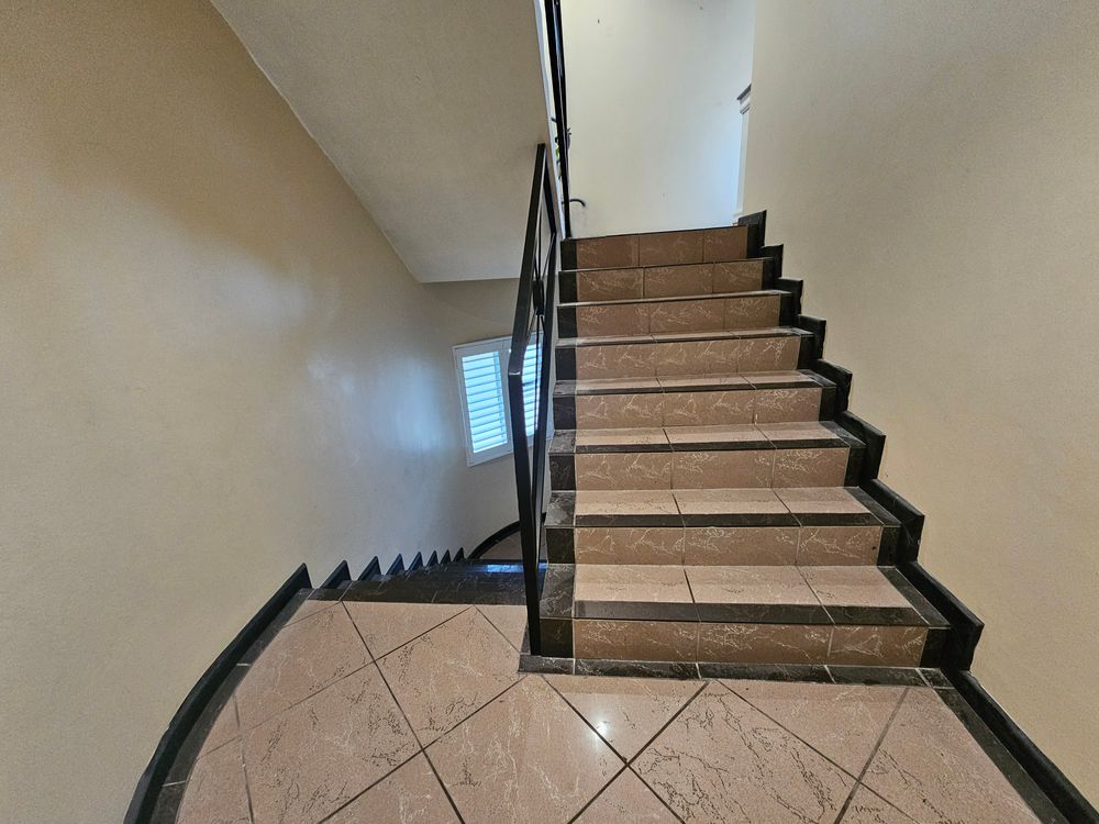 Down stairs leading to other bedrooms