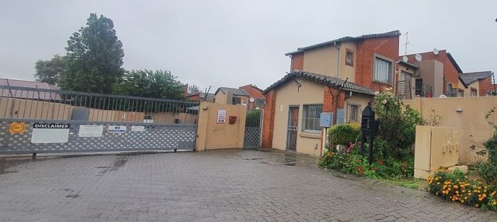 For Sale: Townhouse in Ravensklip with garden, pool, and parking amenities.