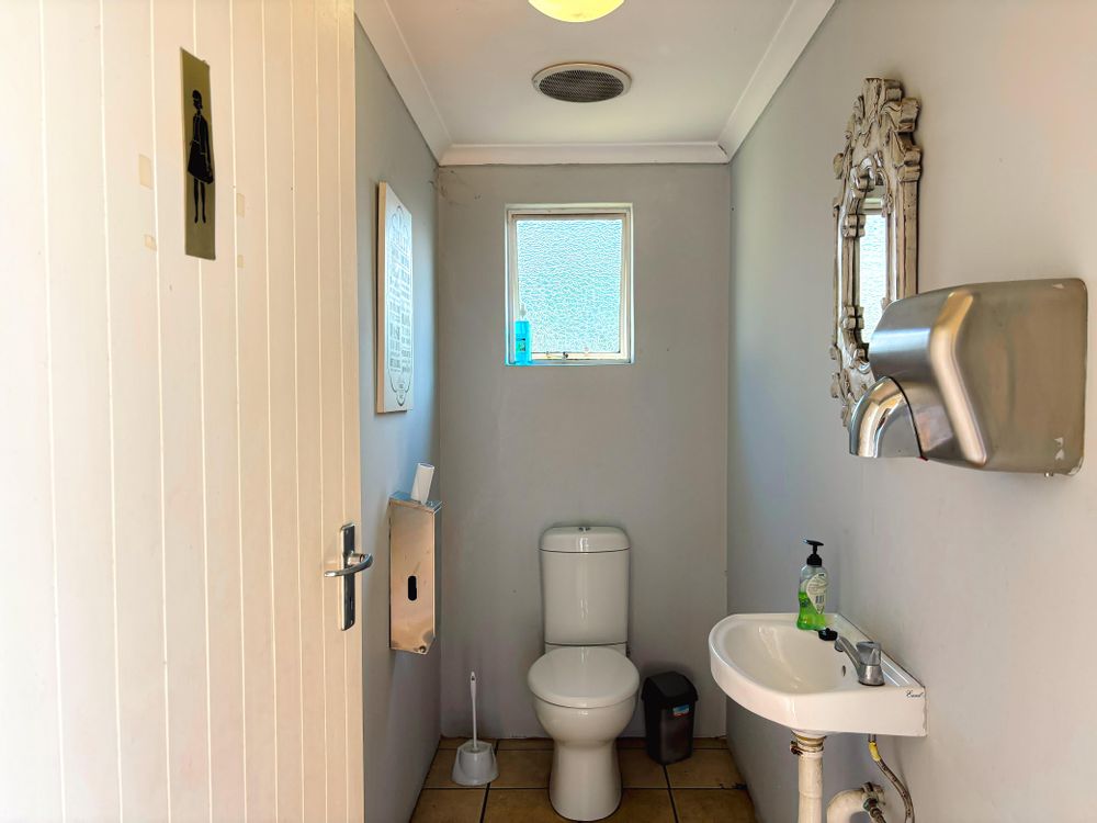 Outdoor male and female toilets with basins