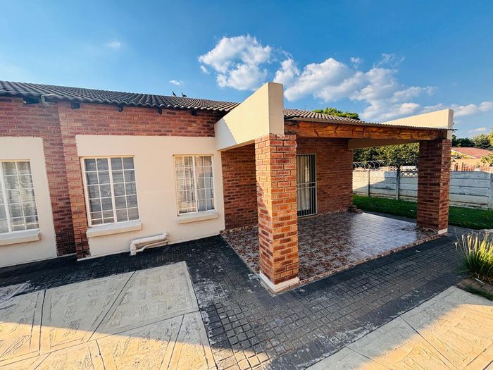 3-Bedroom House in Protea Park For Sale, with paved yard and ample parking.