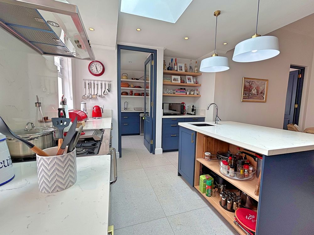 Kitchen area leading into scullery
