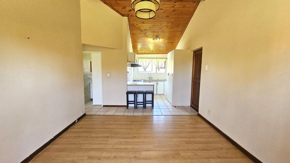 Spacious open plan living area overlooking kitchen