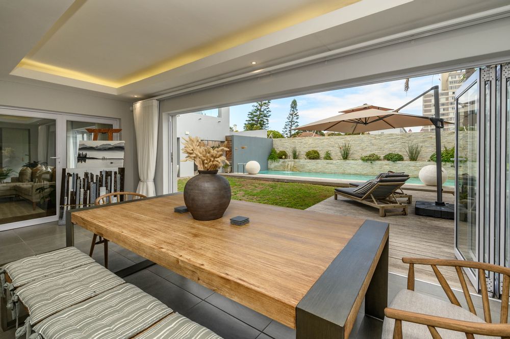 Dining area flowing out to pool
