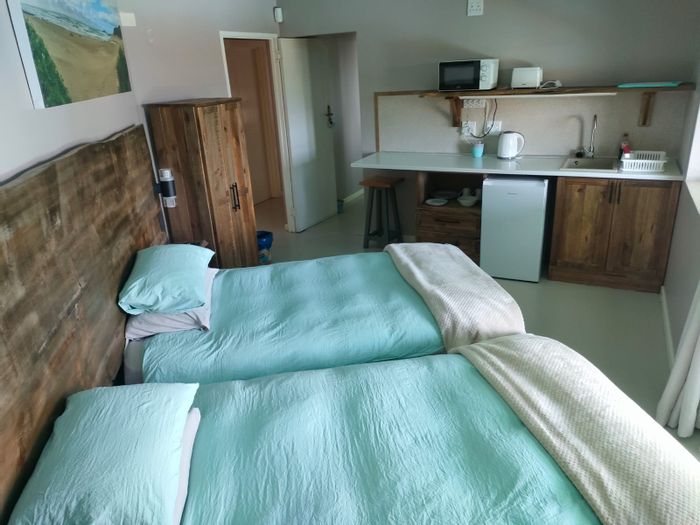 Cove Rock Guest House To Rent: Furnished apartment with sea views, pool, and amenities.