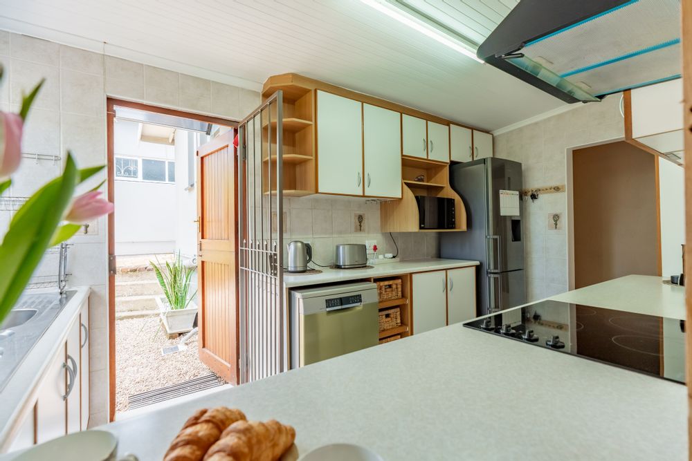 Window from Lounge into Kitchen