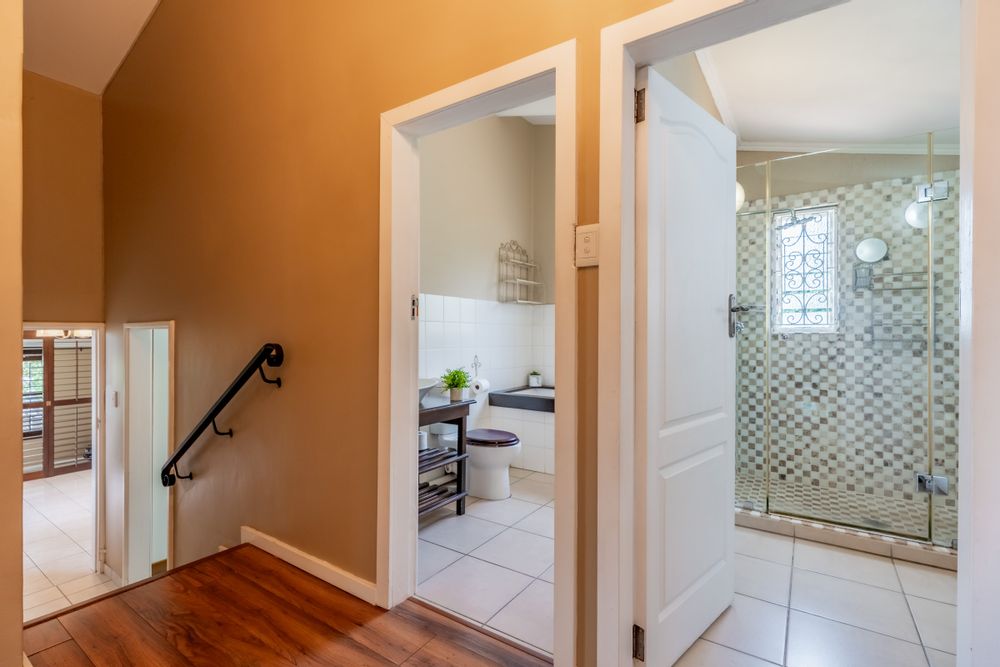 Hallway with entrances to bathrooms