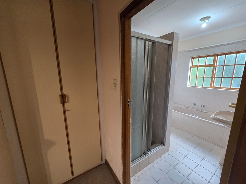 Flat Bathroom With Linen Cupboard