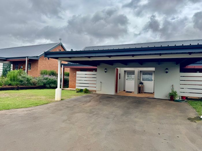 For Sale: Townhouse in St Johns Village with amenities, gardens, and Care Centre access.