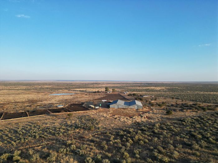 For Sale: Functional farm in Vryburg Rural with feedlot, dwellings, and water resources.