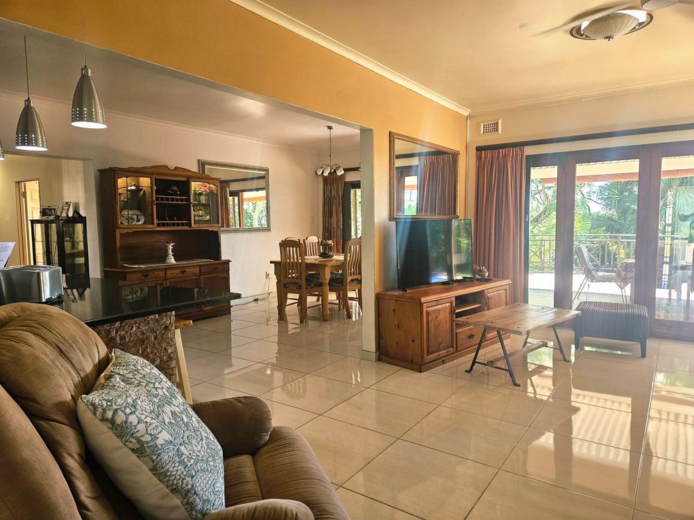 Entrance into large lounge - open plan kitchen