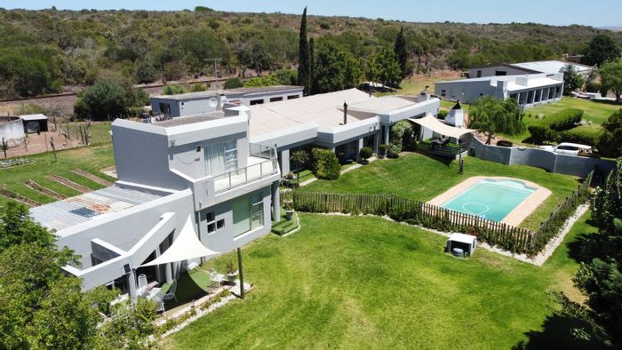 Farm for Sale in Riversdale Rural: Income-Generating Cottages, Pools, and Mountain Views.