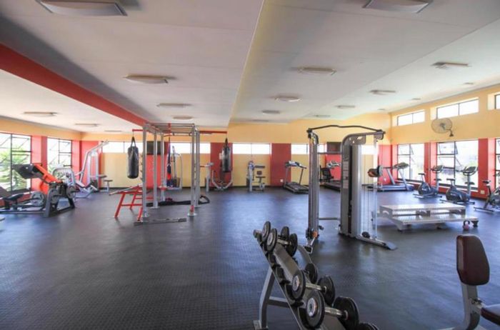 1 Bed Apartment To Rent in Greenstone Hill, includes fridge and laundry appliances.