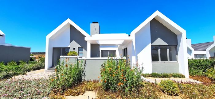 For Sale: House in Langebaan Country Estate with golf course, clubhouse, and gardens.