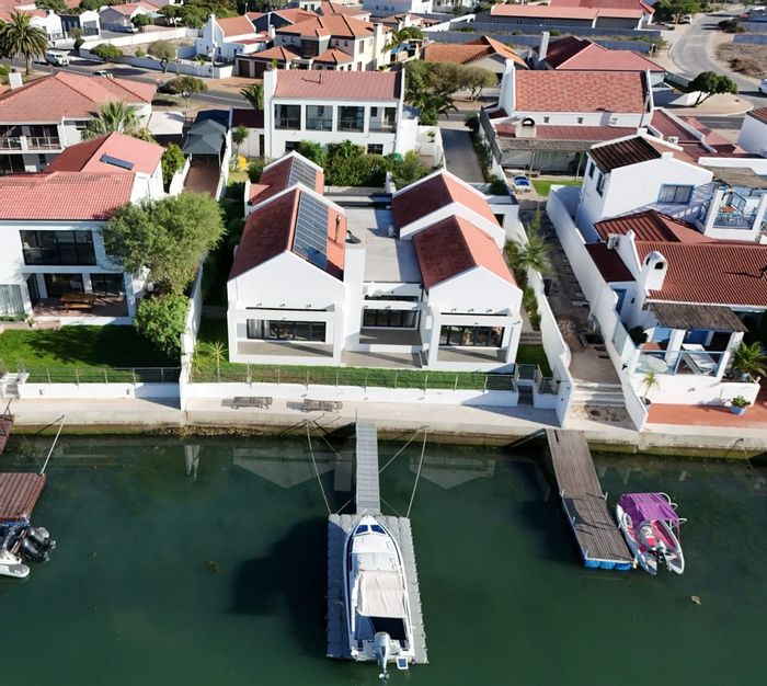 For Sale: House in Port Owen with canal views, pool, and solar power.