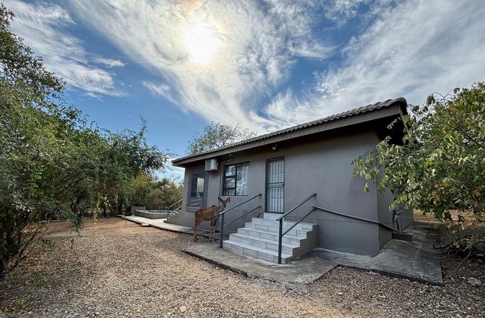 House for Sale in Marloth Park Central: 2 beds, pool, river access, bush views.