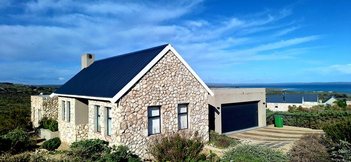 For Sale: House in Shark Bay Estate with lagoon views, patio, and nature access.