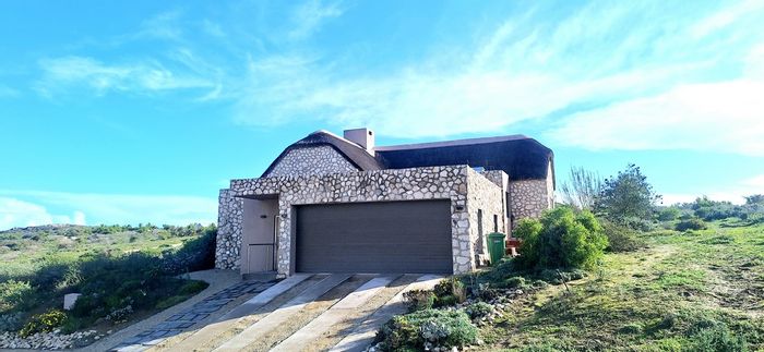House For Sale in Shark Bay Estate: Lagoon views, outdoor patio, eco-friendly living.