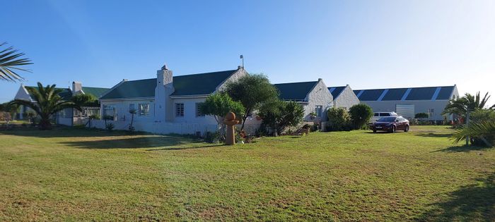 For Sale: House in Long Acres Country Estate with multiple dwellings and horse stables.