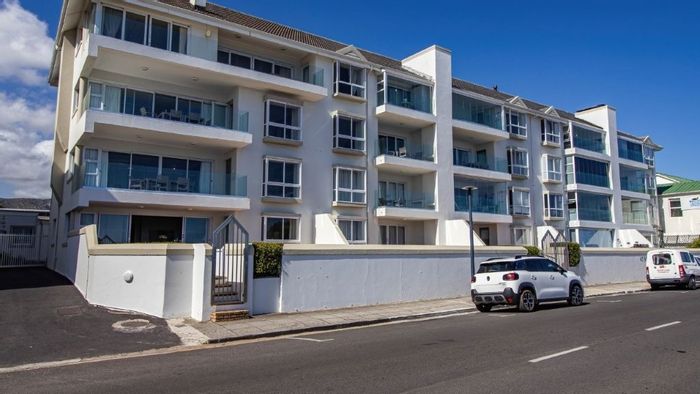 Seafront apartment in Hermanus Central with garage, sea views, and no transfer duty.