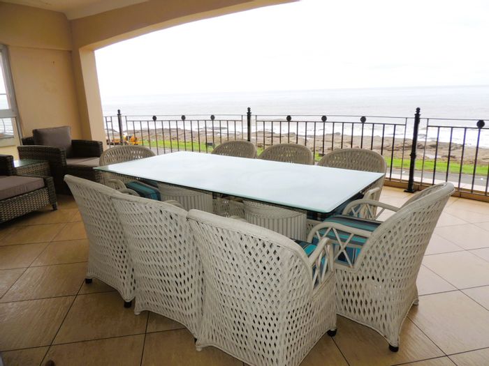 Beachfront apartment in Uvongo for sale, features pool, sea views, and garage.