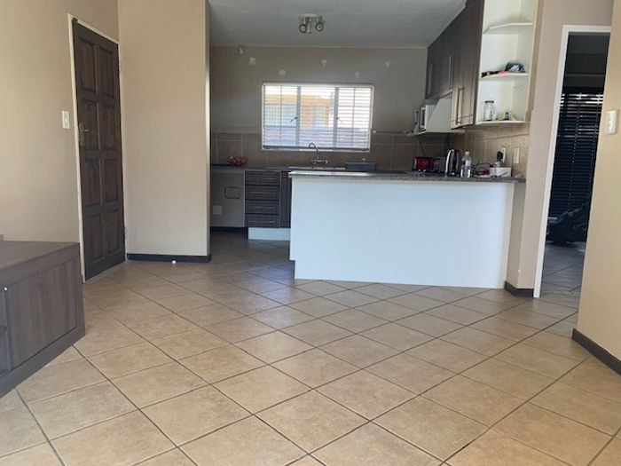 For Sale: Apartment in Mooikloof Ridge with pools, courts, and security access.