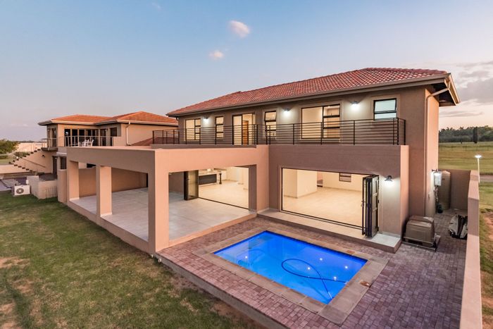 For Sale: House at Club Milos Estate with 4 bedrooms, river views, and garage.
