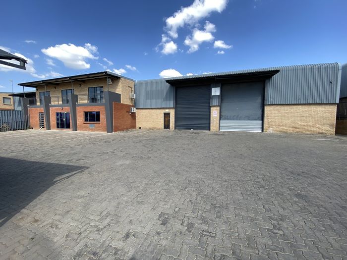 Industrial property in North Riding to rent, featuring warehouse, offices, and truck access.