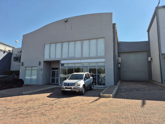 Industrial property for sale in Allandale with drive-in doors, private yard, and offices.