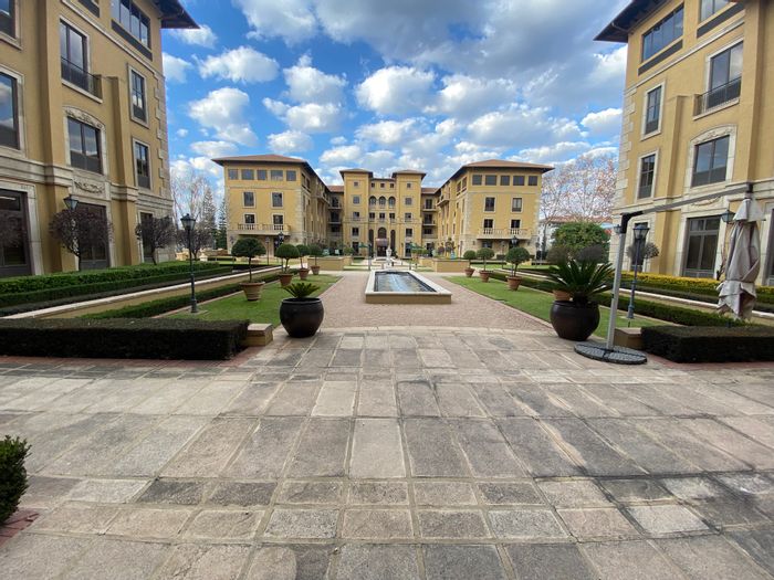 Fourways Office To Rent: Spacious suite with balconies, kitchen, and ample parking.
