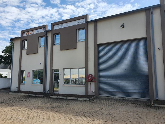 Industrial mini warehouse for sale in Allandale with drive-in access and mezzanine.