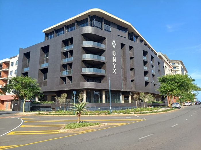 For Sale: Apartment in Umhlanga Ridge with pool, secure parking, and balcony.