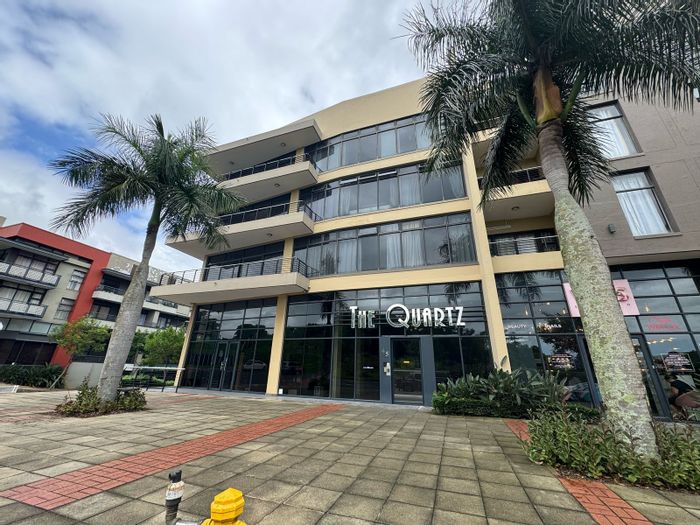 Umhlanga Central Apartment For Sale: 2 Bedrooms, balcony, secure parking, close to amenities.