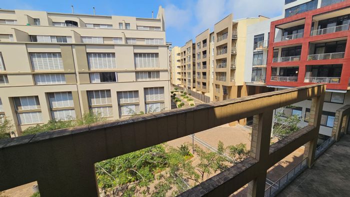For Sale: 2-Bedroom Apartment in Umhlanga Ridge with balcony, security, and parking.