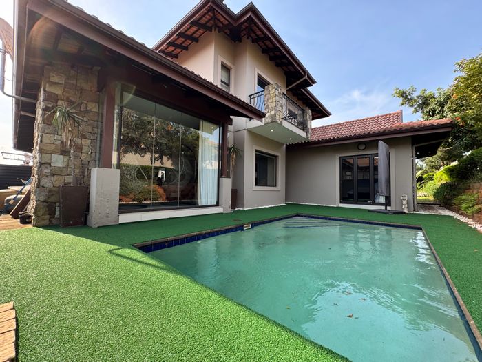 For Sale: Townhouse in Izinga Estate with pool, security, and ample parking.