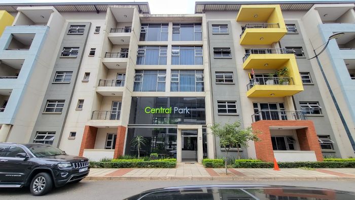 Two-bedroom apartment with pool, gym, balcony, and covered parking in New Town Centre. To Rent.