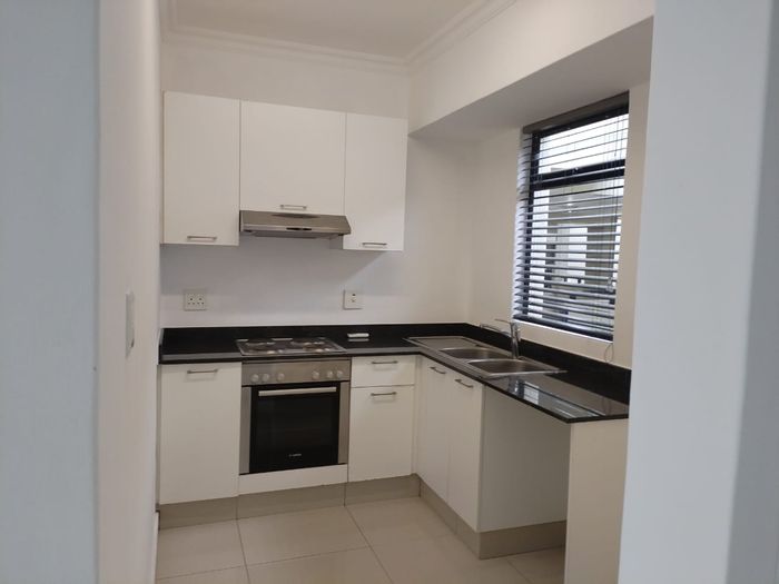 For Sale: 2-Bedroom Apartment in New Town Centre with Balcony and In-Unit Laundry.