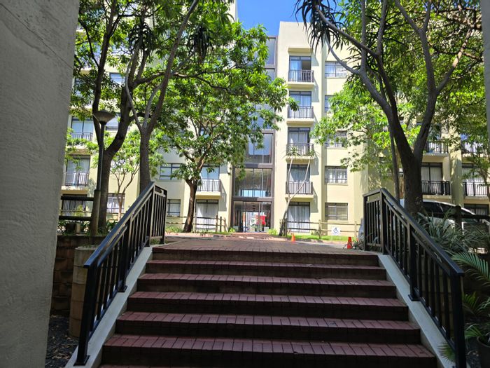 Garden apartment for sale in New Town Centre with secure parking and communal pool.