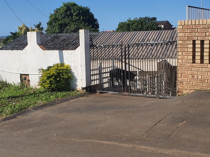 For Sale: Forest Haven Townhouse with 3 bedrooms, rental income, and spacious yard.