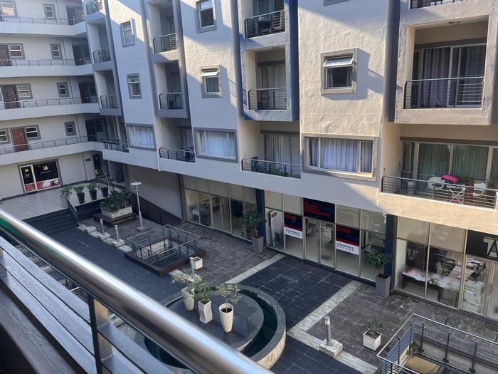 For Sale: Apartment in New Town Centre with rooftop pool and basement parking.