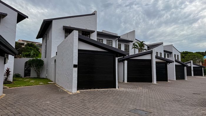 For Sale: 2-Bedroom Townhouse in Umhlanga Central with private garden and garage.