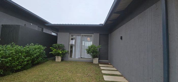 3-Bedroom Townhouse To Rent in Sibaya Precinct with garden, pool, and parking.
