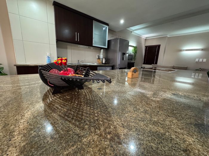 For Sale: Apartment in New Town Centre with 2 beds, balcony, and parking.