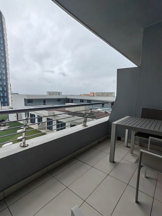 2-Bedroom Apartment To Rent in Umhlanga Central with ocean views and parking.