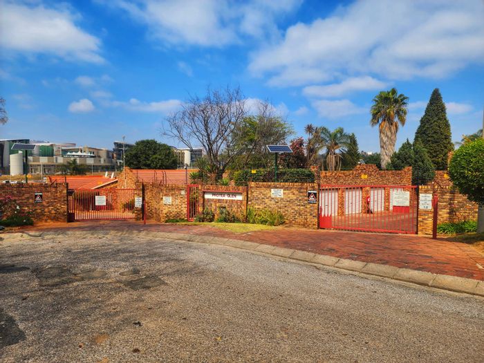 2-Bedroom Townhouse For Sale in Weltevreden Park with pool, garage, and security.