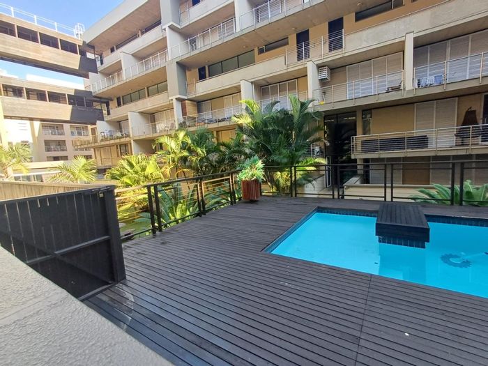 For Sale: Apartment in New Town Centre with pool, garden, and secure parking.