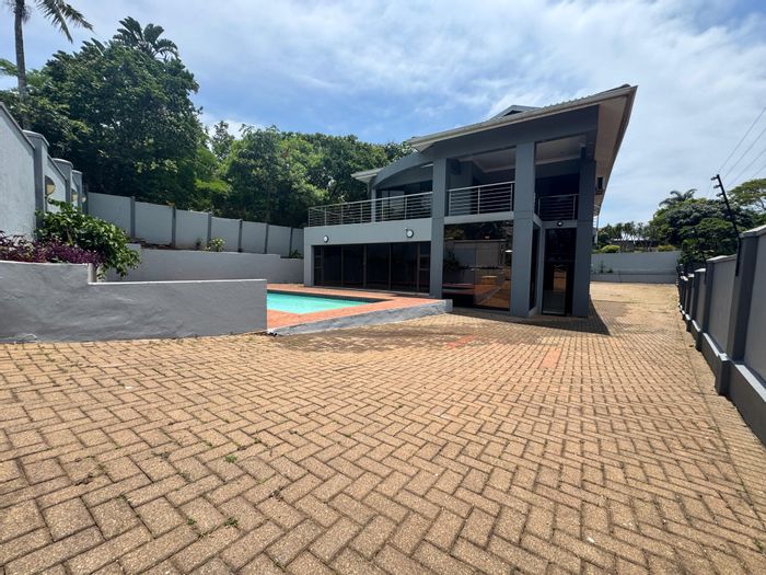 5-bedroom house to rent in Umhlanga Central with pool, balconies, and domestic quarters.