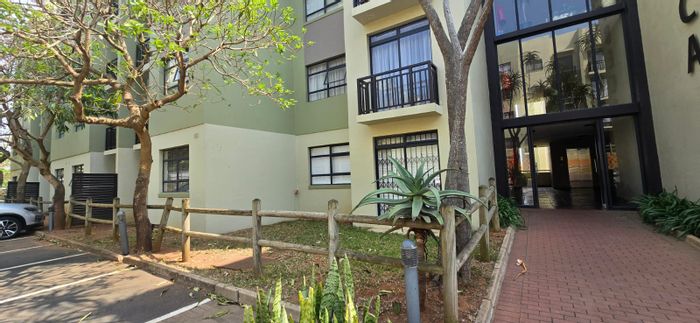 Garden apartment for sale in New Town Centre with pool access and secure parking.