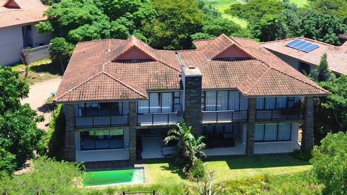 For Sale: House in Port Zimbali with pool, golf course access, and private garden.